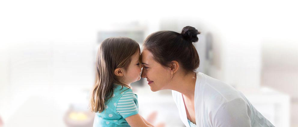 mother and daughter together smiling